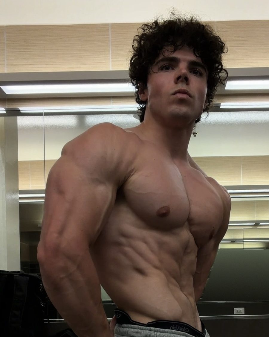 Ben in the same side pose now, leaner and more muscular